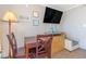 Hotel bedroom with workspace, chair, and beach-themed decorations at 6900 N Ocean Blvd. # 812, Myrtle Beach, SC 29572