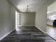 Dining room with hardwood floors, modern chandelier, and easy kitchen access at 104 Sprucewood Ct., Myrtle Beach, SC 29588