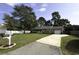 A single story home with a well-maintained lawn, a driveway and mature trees at 104 Sprucewood Ct., Myrtle Beach, SC 29588