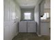 Laundry room featuring a washer, dryer, and access to the kitchen at 104 Sprucewood Ct., Myrtle Beach, SC 29588