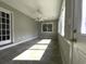 Bright sun room featuring tile floor, ceiling fan and multiple windows at 104 Sprucewood Ct., Myrtle Beach, SC 29588