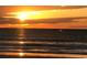 Beautiful sunset over the ocean, providing a serene and picturesque view for luxurious coastal living at 104 Sprucewood Ct., Myrtle Beach, SC 29588