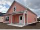New home with a covered back patio and a freshly landscaped yard at 3131 Tiger Tail Rd., Conway, SC 29526