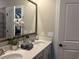 Bathroom featuring dual sinks, brushed-nickel hardware, and a stylish mirror at 3131 Tiger Tail Rd., Conway, SC 29526