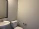 Simple powder room with a white sink, toilet, and industrial towel bar at 3131 Tiger Tail Rd., Conway, SC 29526