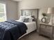 Bedroom featuring a comfortable bed, nightstand, and ample natural light through the window at 3131 Tiger Tail Rd., Conway, SC 29526
