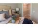 Close up of a well-lit bedroom featuring plush pillows, luxury bedding, and walk-in closet at 3131 Tiger Tail Rd., Conway, SC 29526