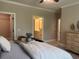 Bedroom view featuring a bed with nightstands and a bathroom and closet nearby at 3131 Tiger Tail Rd., Conway, SC 29526