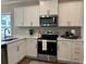 Close up of a stylish kitchen featuring stainless steel appliances and designer backsplash at 3131 Tiger Tail Rd., Conway, SC 29526