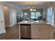 An open-concept kitchen featuring stainless steel appliances, hardwood floors and a view into the spacious living room at 3131 Tiger Tail Rd., Conway, SC 29526