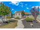 Landscaped backyard featuring a storage shed, flowering trees, and a winding walkway at 3412 Holly Loop, Conway, SC 29527