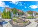 Serene backyard with a decorative brick planter, lush landscaping, and a well-manicured lawn at 3412 Holly Loop, Conway, SC 29527