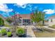 Relaxing backyard featuring a covered patio area, mature trees, and meticulously maintained landscaping at 3412 Holly Loop, Conway, SC 29527