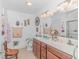 Bathroom with double sink vanity, marble countertops, and decorative fixtures at 3412 Holly Loop, Conway, SC 29527