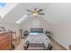 Bright bedroom featuring skylight, ceiling fan, stylish bedframe, and wood furniture at 3412 Holly Loop, Conway, SC 29527