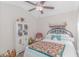 Comfortable bedroom with ceiling fan, quilt bedding, display cabinet, and a cozy chair at 3412 Holly Loop, Conway, SC 29527
