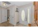 Bright foyer featuring tile flooring, decorative front door, and entry closet at 3412 Holly Loop, Conway, SC 29527