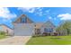Charming single-Gathering home with a well-manicured lawn, attached garage, and neutral colored siding at 3412 Holly Loop, Conway, SC 29527