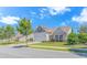 Attractive home showcasing a spacious driveway, manicured lawn, and mature landscaping in a quiet neighborhood at 3412 Holly Loop, Conway, SC 29527