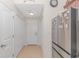 Bright hallway with tiled floor, white walls, and access to multiple rooms at 3412 Holly Loop, Conway, SC 29527