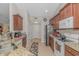 Traditional kitchen with granite countertops, stainless steel appliances, and brown wood cabinets at 3412 Holly Loop, Conway, SC 29527