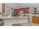 Cozy kitchen with granite countertops, upper cabinets, and bar seating at 3412 Holly Loop, Conway, SC 29527