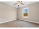 Bedroom featuring a window, neutral carpet, and a ceiling fan at 4512 Old Tram Rd., Conway, SC 29527