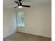 Cozy bedroom featuring plush carpeting and a window overlooking a serene, wooded view at 74 Greentown Rd., Georgetown, SC 29440