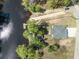 Aerial view of the home on a waterfront lot, surrounded by green trees and lush landscapes at 100 Lure Ct., Conway, SC 29526