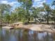 Aerial view showcasing the home and property, highlighting the waterfront access and covered outdoor space at 100 Lure Ct., Conway, SC 29526