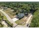 Aerial view of raised beach house with a private boat ramp situated along the river and a private gated entrance at 100 Lure Ct., Conway, SC 29526