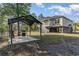 Raised beach house featuring outdoor gazebo overlooking the yard with mature trees and room for outdoor entertaining at 100 Lure Ct., Conway, SC 29526