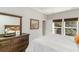 This bedroom features a comfy bed, wood dresser with a large mirror, and view to the backyard at 100 Lure Ct., Conway, SC 29526
