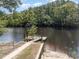 This property features a private dock, perfect for enjoying waterfront living and recreational activities at 100 Lure Ct., Conway, SC 29526