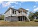 View of the rear of the home with covered parking and the staircase leading to the porch at 100 Lure Ct., Conway, SC 29526