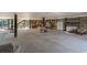 Large open garage with shelving and storage, perfect for outdoor enthusiasts and accessing the waterfront at 100 Lure Ct., Conway, SC 29526