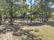 Covered outdoor area with benches and a firepit, perfect for outdoor relaxation at 100 Lure Ct., Conway, SC 29526