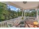 Relaxing outdoor porch with comfortable seating overlooking a scenic waterfront view at 100 Lure Ct., Conway, SC 29526