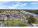 Scenic aerial view showcasing a residential community along a waterway, lush green spaces, and a well-planned layout at 202 Ave. Of The Palms, Myrtle Beach, SC 29579