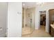 Bright bathroom with glass enclosed shower and a view into the walk-in closet at 202 Ave. Of The Palms, Myrtle Beach, SC 29579