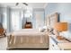 Light and airy bedroom with hardwood floors, neutral color walls, and traditional furnishings at 202 Ave. Of The Palms, Myrtle Beach, SC 29579