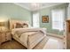 Serene bedroom featuring hardwood floors, large windows, a chandelier, and soft green walls at 202 Ave. Of The Palms, Myrtle Beach, SC 29579