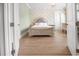 Bright bedroom showcases beautiful hard wood floors, decorative wallpaper, and a chandelier at 202 Ave. Of The Palms, Myrtle Beach, SC 29579