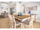This dining room offers hardwood floors, seating for eight, and natural light at 202 Ave. Of The Palms, Myrtle Beach, SC 29579