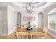 Bright dining area featuring a table, hardwood floors, and chandelier at 202 Ave. Of The Palms, Myrtle Beach, SC 29579