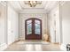 Inviting foyer featuring a decorative front door, trey ceiling and hardwood floors at 202 Ave. Of The Palms, Myrtle Beach, SC 29579