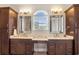 Main bathroom featuring double sinks, large mirrors, great lighting, and vanity area at 202 Ave. Of The Palms, Myrtle Beach, SC 29579