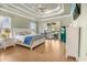 Tranquil main bedroom with a ceiling fan, hardwood floors, and plenty of natural light at 202 Ave. Of The Palms, Myrtle Beach, SC 29579