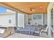 Elegant outdoor patio with built-in grill, dining, seating and entertainment area perfect for entertaining guests at 202 Ave. Of The Palms, Myrtle Beach, SC 29579