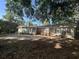 Spacious backyard featuring a concrete patio and mature trees that offer plenty of shade and privacy at 902 N 11Th Ave. N, North Myrtle Beach, SC 29582